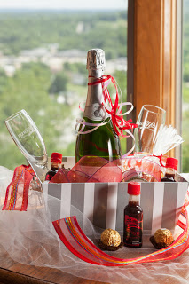 gift basket with champagne and other liquors with flutes