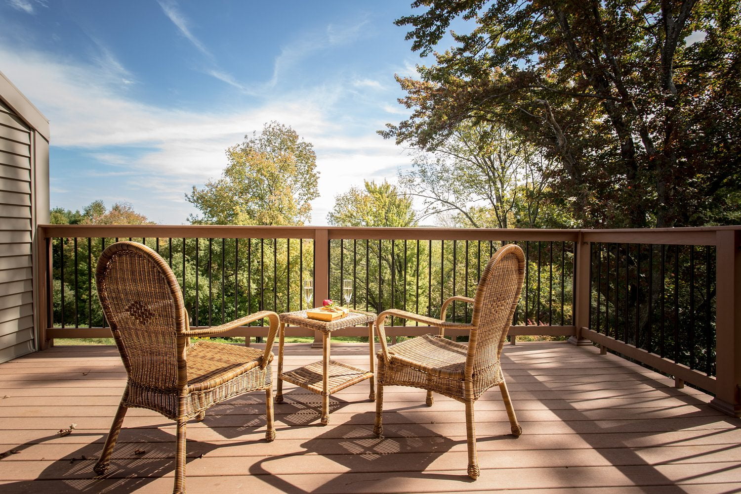 The French Manor porch with two wicker chairs and romantic drinks