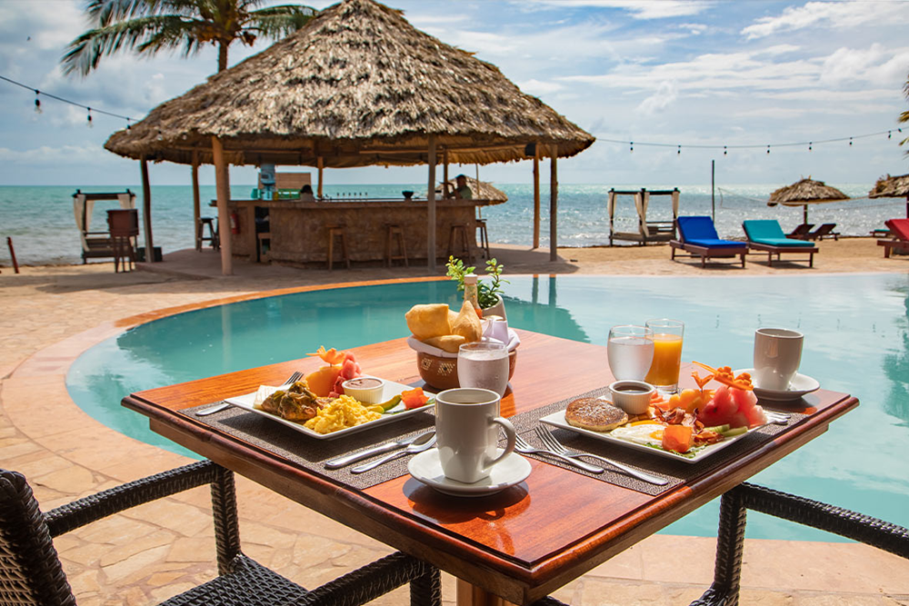 Breakfast beside the infinity pool and beachfront Tiki Bar at Belizean Dreams