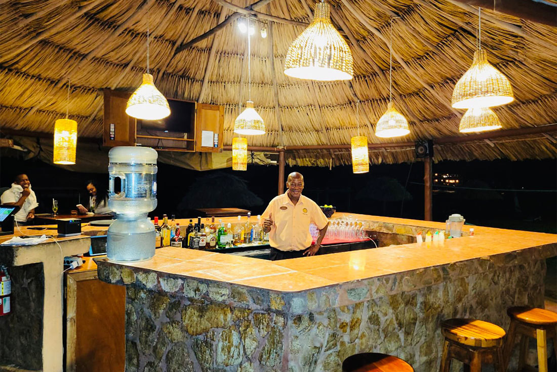 Bartender at the thatched Woven Palms Tiki Bar
