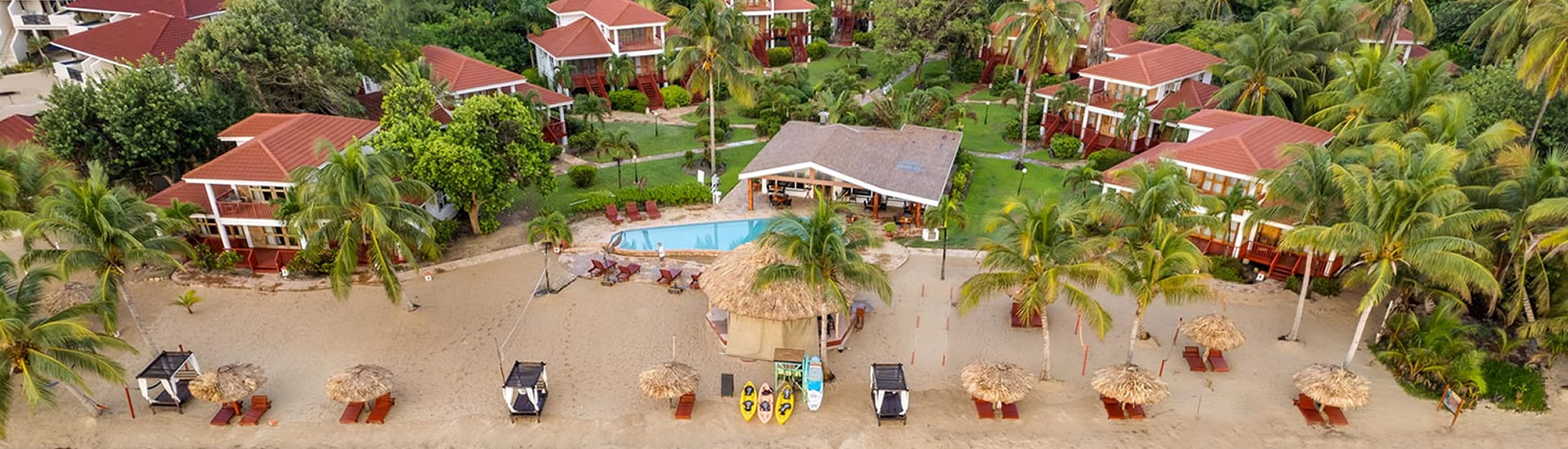 Aerial view of Belizean Dreams villas, beach and pool on the Hopkins coast