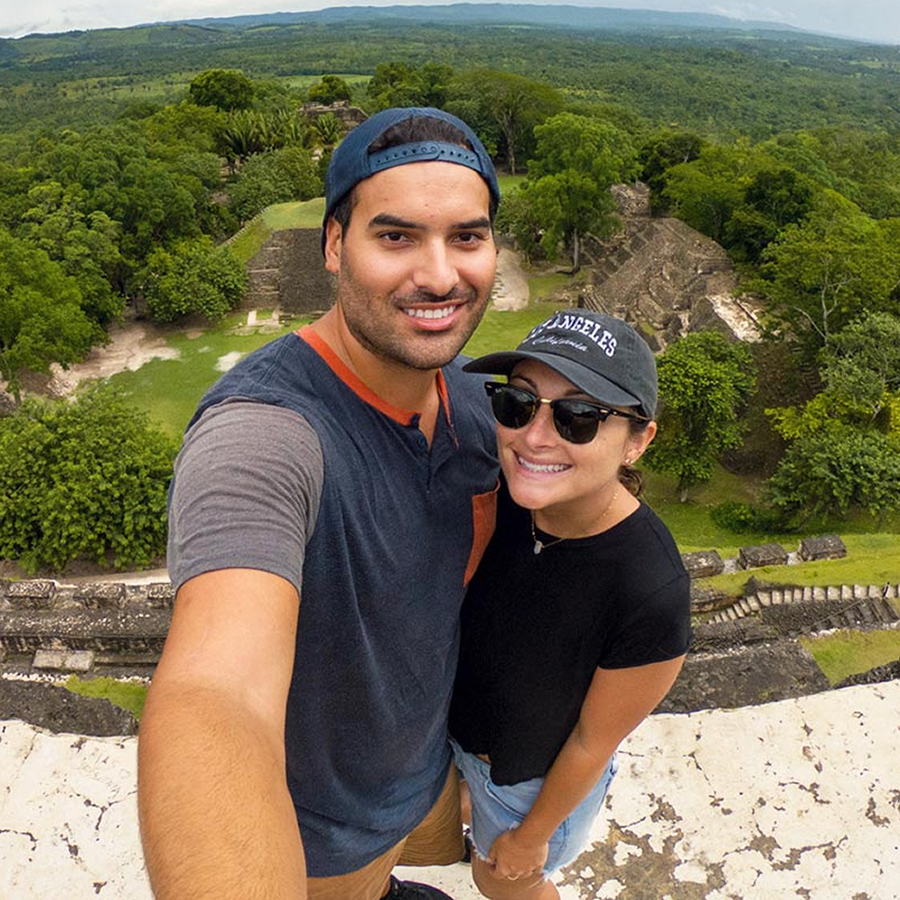Couple taking a selfie in front of Maya ruins in Belize