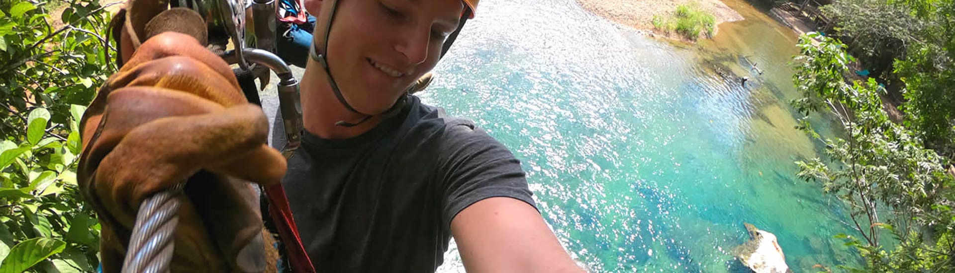 Guest on a guided zipline adventure in Belize