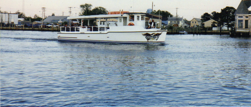 The Osprey, a 50-passenger wooden tour boat, under way past the Chincoteague waterfront