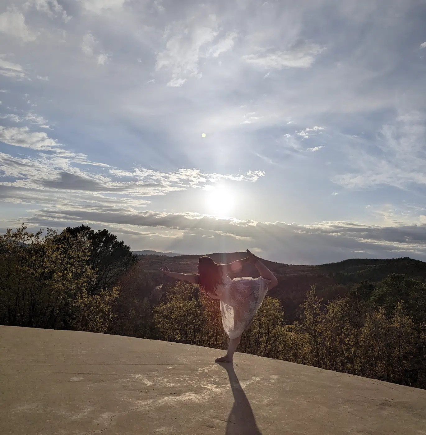 Wellness Elevated: Unlocking Nature's Benefits at Zion Ponderosa 10 A woman practicing sunset yoga in East Zion