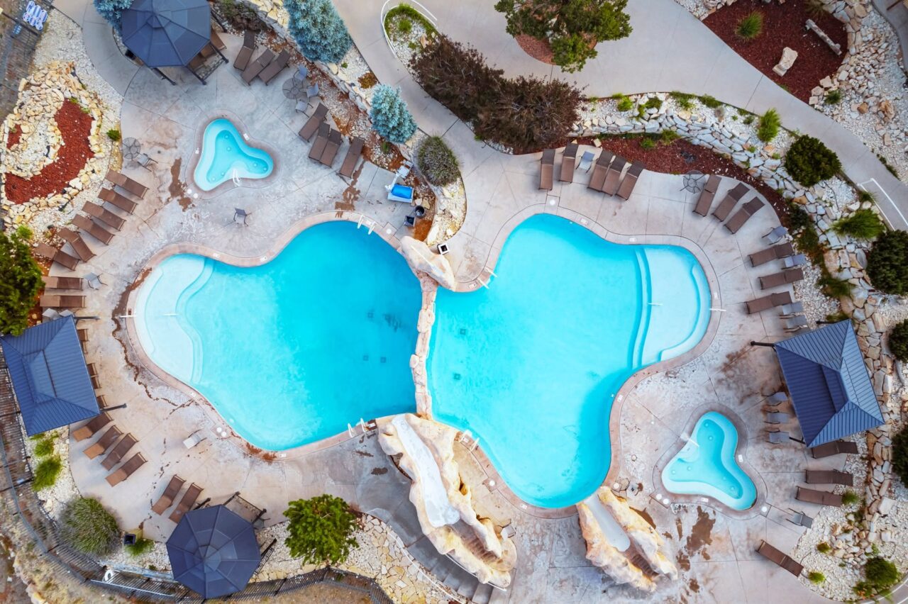 Have You Checked These Off Your Zion Summer Bucket List? 17 An aerial view of Zion Ponderosa's two-tiered pool and hot tubs