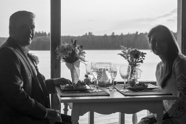 Black and white shot of a couple having romantic dinner