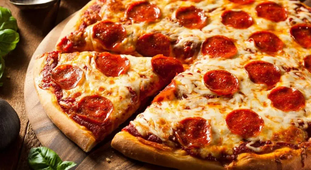 Close up view of cheesy pepperoni pizza with homemade crust