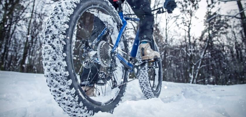 person fat tire biking in winter