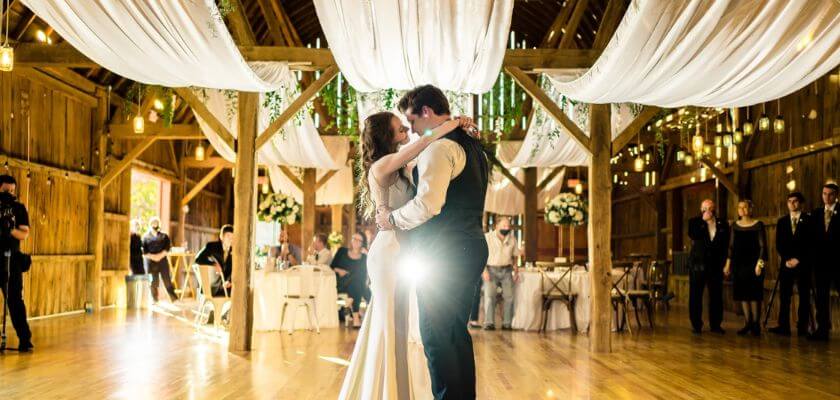 bridal couple dancing in the elegant barn at justin trails resort